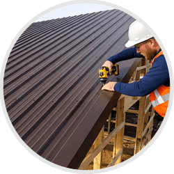 roofer fixing corrugated sheet roof