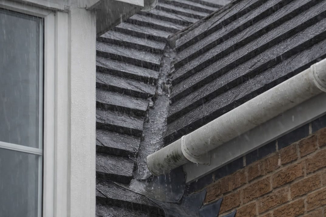 damaged roof tiles in roof valley