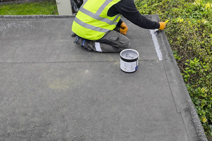 felt roof applying one coat instant waterproofing sealant on roof