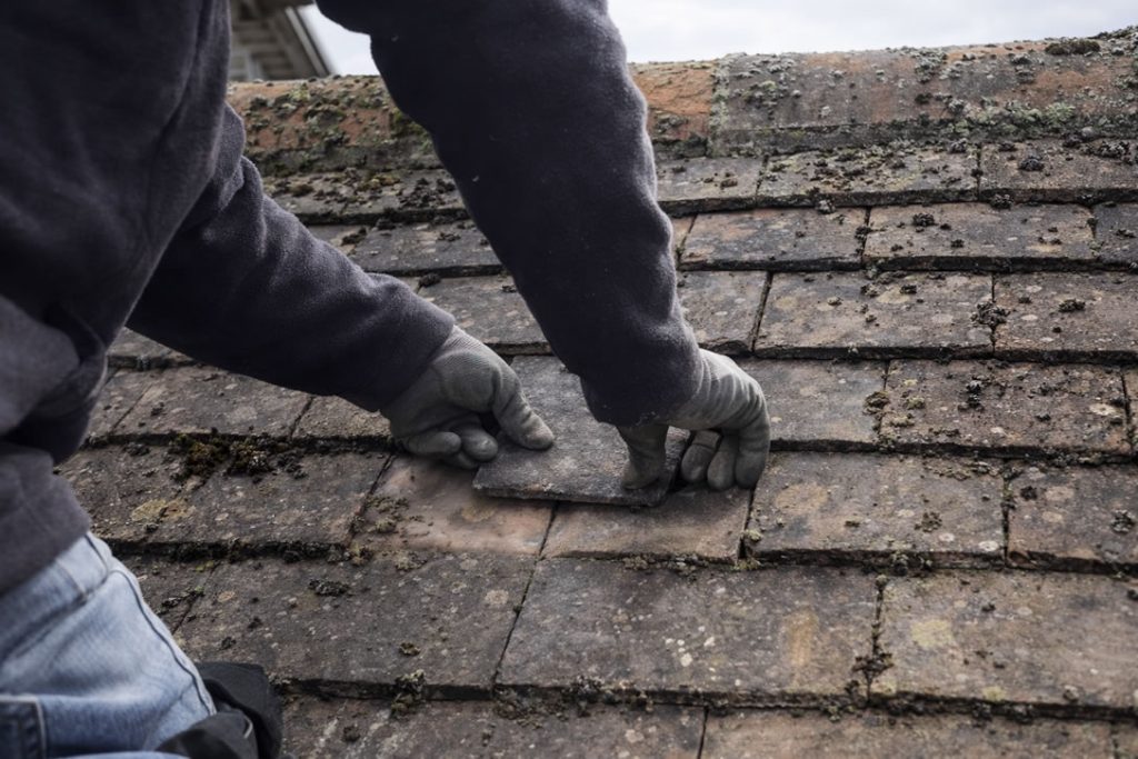 fitting slipped roof tile pitched roof repairs uk