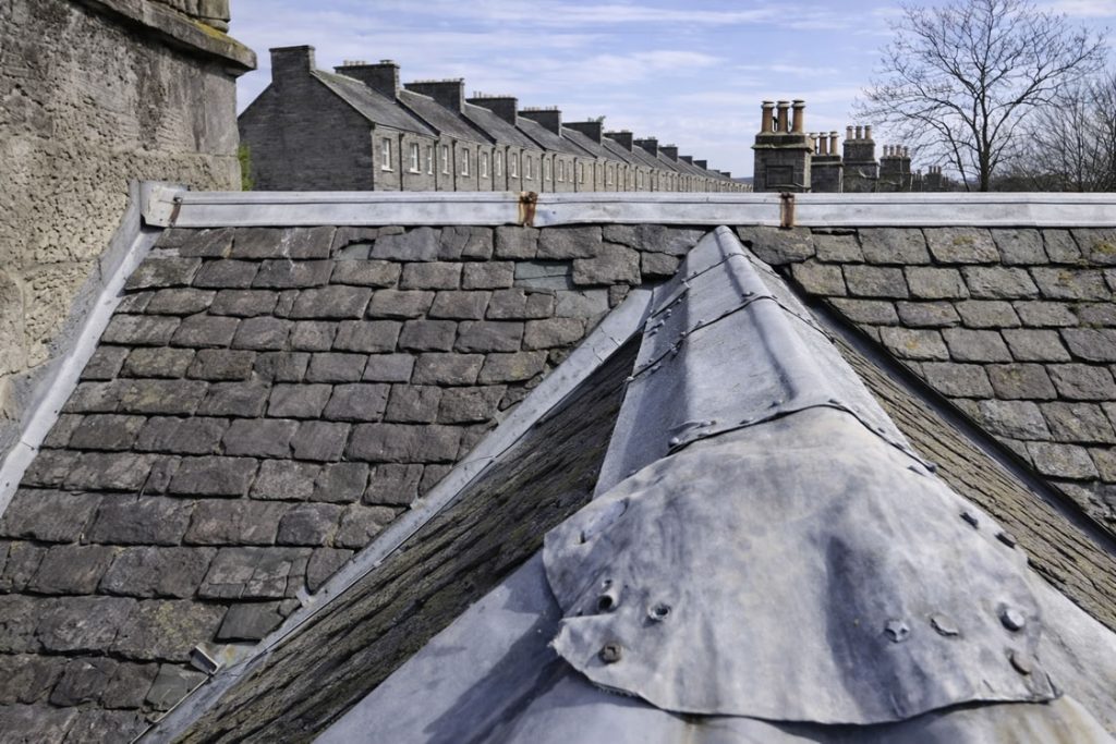 lead-work repairs on old slate tiled roof fixing leaking roof